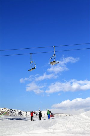 simsearch:400-08780271,k - Three skiers on slope at sun winter day. Greater Caucasus, Mount Shahdagh, Azerbaijan. Photographie de stock - Aubaine LD & Abonnement, Code: 400-08892772