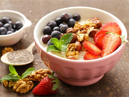 porridge and berries - Oatmeal porridge with nuts and berries for a healthy breakfast Stock Photo - Budget Royalty-Free & Subscription, Code: 400-08893390