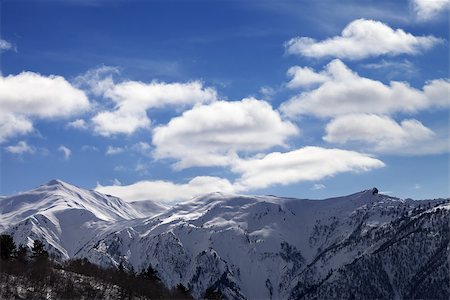 simsearch:400-08671175,k - Sunlight snow mountains and blue sky with clouds. Caucasus Mountains. Svaneti region of Georgia. Stock Photo - Budget Royalty-Free & Subscription, Code: 400-08893554