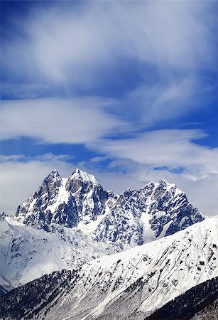 simsearch:400-07093256,k - Mounts Ushba and Chatyn and blue sky with clouds in winter wind day. Caucasus Mountains. Svaneti region of Georgia. Stock Photo - Budget Royalty-Free & Subscription, Code: 400-08893552