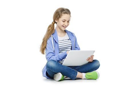 Beautiful teen age girl in casual clothes sitting on floor with big electronic tablet. Isolated on white background. Stock Photo - Budget Royalty-Free & Subscription, Code: 400-08900098