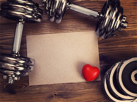toned image of metal dumbbells and a red heart on a wooden background Stock Photo - Budget Royalty-Free & Subscription, Code: 400-08916223