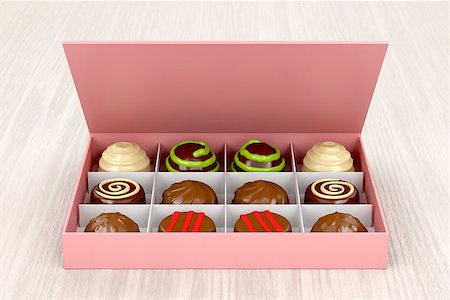 praline - Gift box with chocolate candies on wooden table Stock Photo - Budget Royalty-Free & Subscription, Code: 400-08919456
