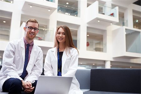 Portrait Of Two Doctors Meeting In Hospital Reception Area Stock Photo - Budget Royalty-Free & Subscription, Code: 400-08937514