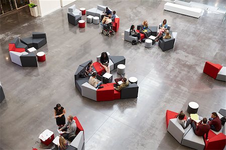simsearch:400-08937692,k - Students sit in groups in a modern university atrium Stock Photo - Budget Royalty-Free & Subscription, Code: 400-08937676