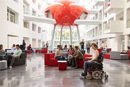 simsearch:400-08937692,k - Student in wheelchair and colleagues in university lobby Stock Photo - Budget Royalty-Free & Subscription, Code: 400-08937688