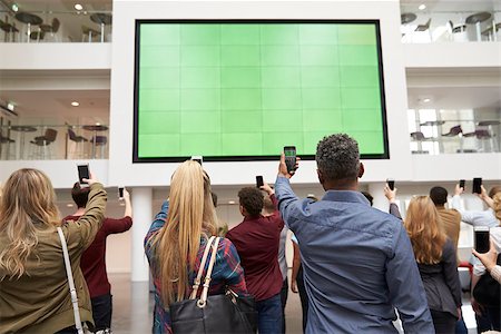 simsearch:400-08937692,k - Students photographing big screen with phones, back view Stock Photo - Budget Royalty-Free & Subscription, Code: 400-08937719