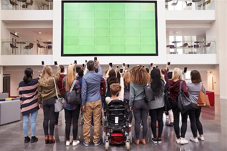 simsearch:400-08937692,k - Students photograph screen with phones, back view full length Stock Photo - Budget Royalty-Free & Subscription, Code: 400-08937724