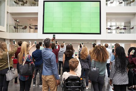 simsearch:400-08937692,k - Students photographing big screen with phones, back view Stock Photo - Budget Royalty-Free & Subscription, Code: 400-08937721