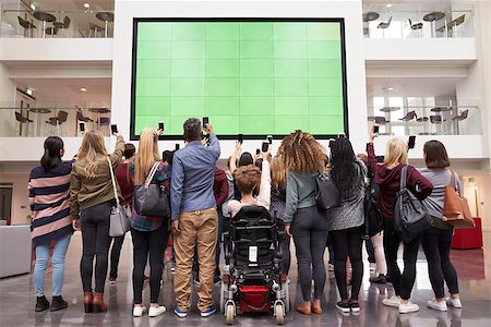 simsearch:400-08937692,k - Students photograph screen with phones, back view full length Stock Photo - Budget Royalty-Free & Subscription, Code: 400-08937723