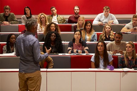 simsearch:400-08937692,k - Back view of man presenting to students at a lecture theatre Stock Photo - Budget Royalty-Free & Subscription, Code: 400-08937765