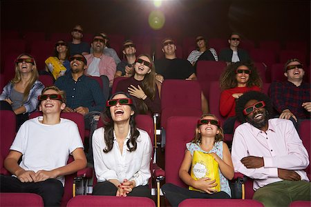 photo of theatre audience laughing - Audience In Cinema Wearing 3D Glasses Watching Comedy Film Stock Photo - Budget Royalty-Free & Subscription, Code: 400-08937955