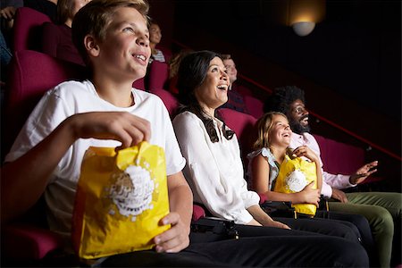 Audience In Cinema Watching Comedy Film Stock Photo - Budget Royalty-Free & Subscription, Code: 400-08937959