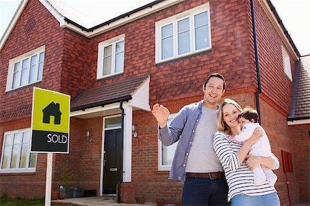 family with sold sign - Portrait Of Young Family With Keys To New Home Stock Photo - Budget Royalty-Free & Subscription, Code: 400-08938261