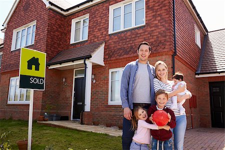 family with sold sign - Portrait Of Family Outside New Home With Sold Sign Stock Photo - Budget Royalty-Free & Subscription, Code: 400-08938262