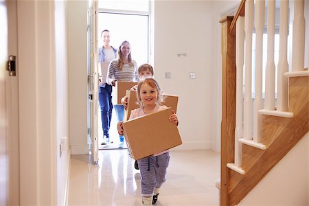 simsearch:400-08938320,k - Family Carrying Boxes Into New Home On Moving Day Stock Photo - Budget Royalty-Free & Subscription, Code: 400-08938305