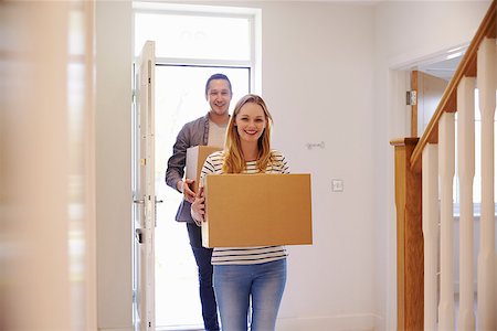 simsearch:400-08938320,k - Couple Carrying Boxes Into New Home On Moving Day Stock Photo - Budget Royalty-Free & Subscription, Code: 400-08938306