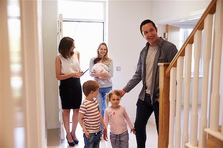 simsearch:400-08938320,k - Realtor Showing Young Family Around Property For Sale Stock Photo - Budget Royalty-Free & Subscription, Code: 400-08938300