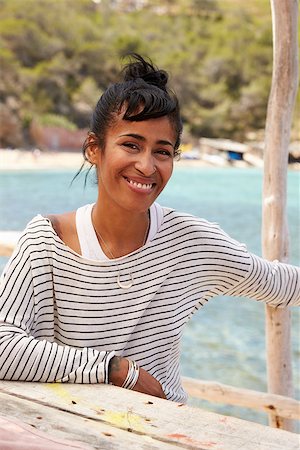 Middle aged couple smiling across a table by the sea, Ibiza Stock Photo - Budget Royalty-Free & Subscription, Code: 400-08938468