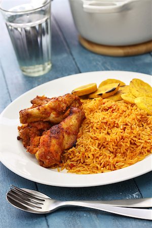 fried chicken with banana - jollof rice with chicken and fried plantain, west african cuisine Stock Photo - Budget Royalty-Free & Subscription, Code: 400-08931340