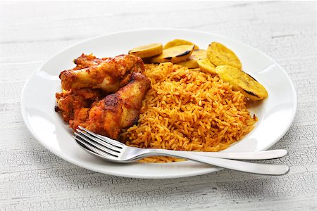 fried chicken with banana - jollof rice with chicken and fried plantain, west african cuisine Stock Photo - Budget Royalty-Free & Subscription, Code: 400-08931503
