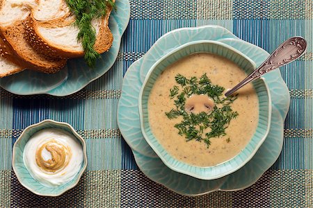 simsearch:400-08014878,k - Cheese soup with mushrooms with mustard cream sauce and fresh bread served in original flower-like crockery Stock Photo - Budget Royalty-Free & Subscription, Code: 400-08955587