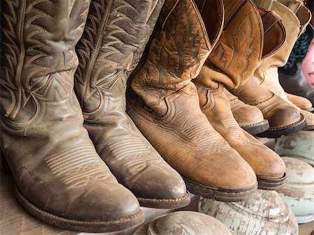 rodeo - Cowboy boot on the shelf Stockbilder - Microstock & Abonnement, Bildnummer: 400-08957474