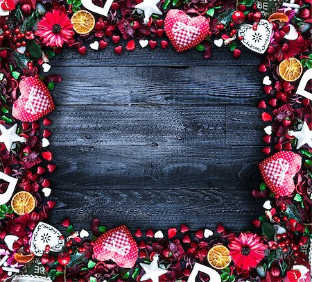 simsearch:400-08034170,k - Valentine's Day Background with love themed elements like cotton and paper hearts, flowers, berries, oranges and other decorations. Wooden old parquet on the back. Photographie de stock - Aubaine LD & Abonnement, Code: 400-08958150
