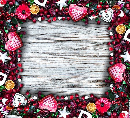 simsearch:400-08034173,k - Valentine's Day Background with love themed elements like cotton and paper hearts, flowers, berries, oranges and other decorations. Wooden old parquet on the back. Stockbilder - Microstock & Abonnement, Bildnummer: 400-08958153