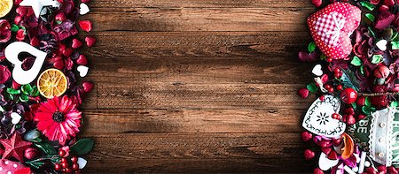 simsearch:400-08034173,k - Valentine's Day Background with love themed elements like cotton and paper hearts, flowers, berries, oranges and other decorations. Wooden old parquet on the back. Stockbilder - Microstock & Abonnement, Bildnummer: 400-08958166