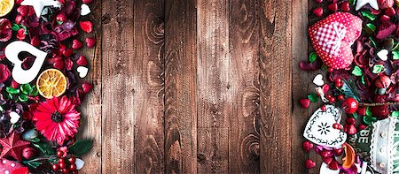 simsearch:400-08034170,k - Valentine's Day Background with love themed elements like cotton and paper hearts, flowers, berries, oranges and other decorations. Wooden old parquet on the back. Photographie de stock - Aubaine LD & Abonnement, Code: 400-08958160