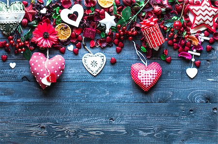 simsearch:400-08034170,k - Valentine's Day Background with love themed elements like cotton and paper hearts, flowers, berries, oranges and other decorations. Wooden old parquet on the back. Photographie de stock - Aubaine LD & Abonnement, Code: 400-08958182