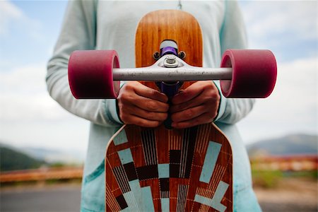 simsearch:400-08400086,k - girl with longboard in hands closeup Stock Photo - Budget Royalty-Free & Subscription, Code: 400-08958740
