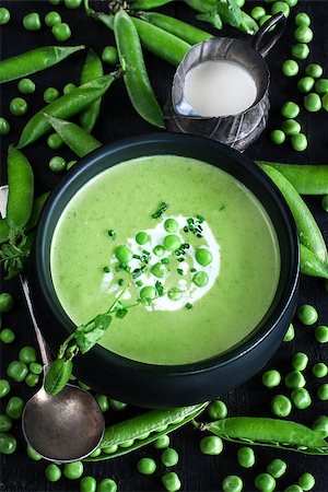 simsearch:400-07298426,k - Green peas soup on dark wooden background. Low key photo. Stock Photo - Budget Royalty-Free & Subscription, Code: 400-08959709