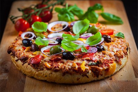 simsearch:400-08964146,k - Traditional homemade pizza with tomatoes, olives and basil Stock Photo - Budget Royalty-Free & Subscription, Code: 400-08964145