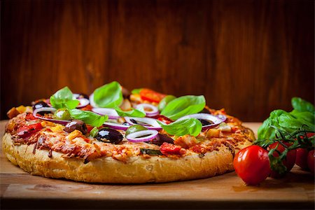 simsearch:400-08964146,k - Traditional homemade pizza with tomatoes, olives and basil Stock Photo - Budget Royalty-Free & Subscription, Code: 400-08964146