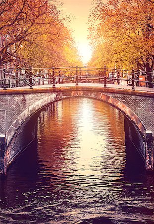 simsearch:400-05880107,k - Bridge over channel in Amsterdam Netherlands autumn urban landscape with yellow tree on bank river sunny day old european town. Stockbilder - Microstock & Abonnement, Bildnummer: 400-08964687