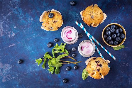 Homemade muffins with blueberries and yogurt with mint. Top view. Selective focus. Fotografie stock - Microstock e Abbonamento, Codice: 400-08964699