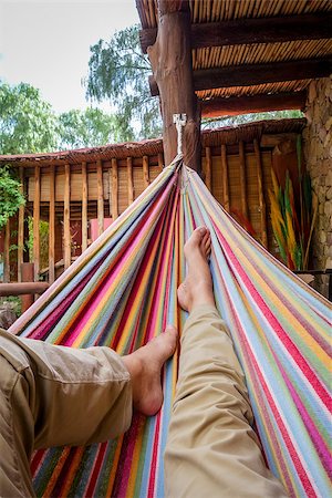 Man relaxing in a colored hammock. subjective view Stock Photo - Budget Royalty-Free & Subscription, Code: 400-08964877