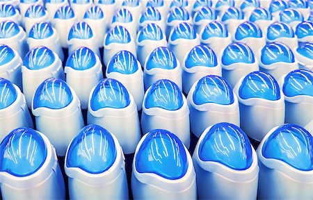 simsearch:6113-06626648,k - Deodorant, bottles with blue lids in a row. Background Stockbilder - Microstock & Abonnement, Bildnummer: 400-08964992