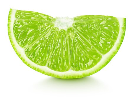 simsearch:400-08967896,k - Ripe slice of green lime citrus fruit isolated on white background Photographie de stock - Aubaine LD & Abonnement, Code: 400-08965198