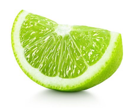 simsearch:400-08900179,k - Ripe wedge of green lime citrus fruit isolated on white background. Lime slice with clipping path Photographie de stock - Aubaine LD & Abonnement, Code: 400-08961975