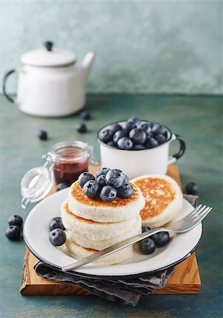 photos of blueberries for kitchen - Cottage cheese pancakes with blueberries, homemade traditional Ukrainian and Russian cuisine. Selective focus. Stock Photo - Budget Royalty-Free & Subscription, Code: 400-08962998