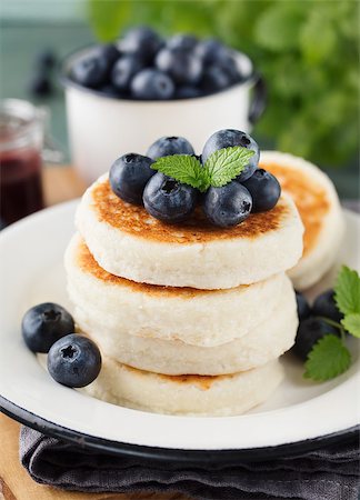photos of blueberries for kitchen - Cottage cheese pancakes with blueberries and mint, close up. Healthy Breakfast. Selective focus Stock Photo - Budget Royalty-Free & Subscription, Code: 400-08963832