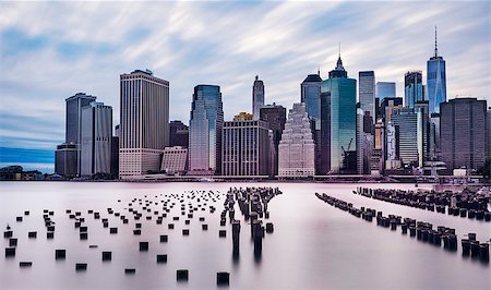 dramatic scenery of lower manhattan skyline in the evening on a cloudy day, longterm exposure Photographie de stock - Aubaine LD & Abonnement, Code: 400-08982416