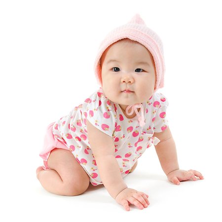 simsearch:400-07173561,k - Portrait of full length cute Asian baby girl in pink clothes crawling on floor, isolated on white background. Foto de stock - Royalty-Free Super Valor e Assinatura, Número: 400-08996832