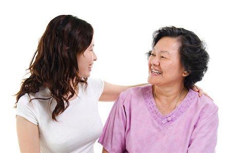 Portrait of Asian senior mother and adult daughter talking and looking at each other, isolated on white background. Stock Photo - Budget Royalty-Free & Subscription, Code: 400-08996833