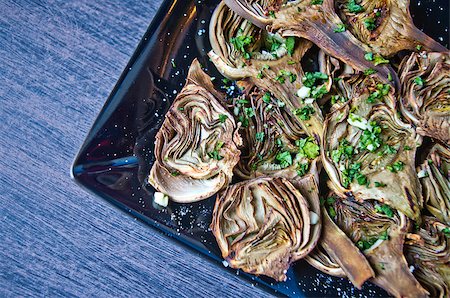 simsearch:400-07219392,k - artichokes baked in oven seasoned only with extra virgin olive oil, parsley and lemon are a healthy and purifying food to stay fit during the summer Stock Photo - Budget Royalty-Free & Subscription, Code: 400-08996902