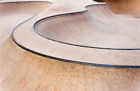 photojope (artist) - Background of an empty bowl with rails in a concrete skate park. Fotografie stock - Microstock e Abbonamento, Codice: 400-08997596