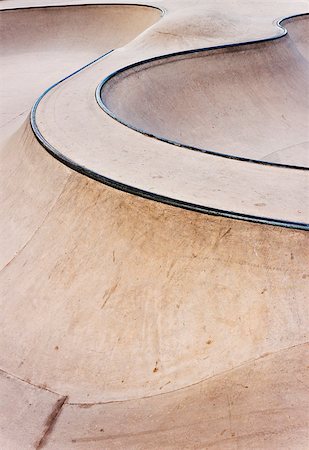 photojope (artist) - Background of an empty bowl with rails in a concrete skate park. Fotografie stock - Microstock e Abbonamento, Codice: 400-08997597
